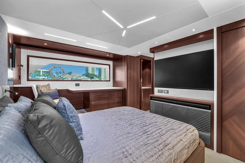  Yacht Photos Pics Luxurious interior of 2023 Sunseeker Manhattan 68 yacht bedroom with modern design elements.