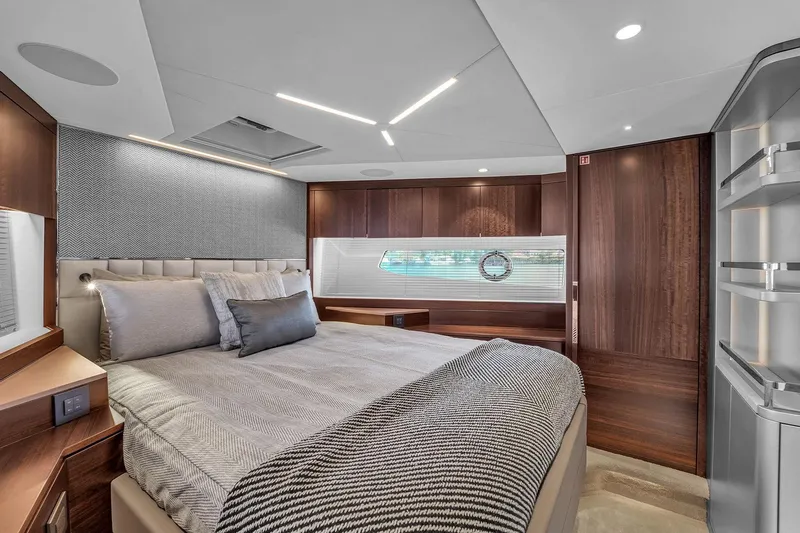  Yacht Photos Pics Luxurious bedroom interior of 2023 Sunseeker Manhattan 68 yacht with modern design.