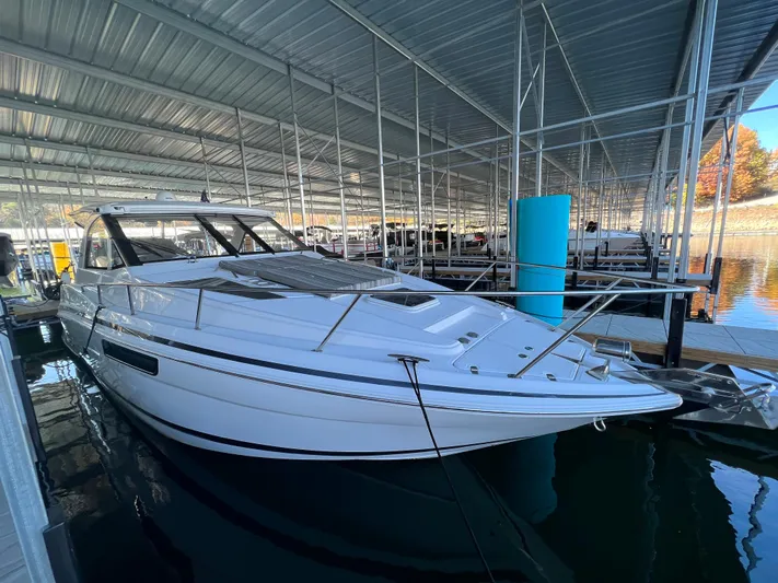  Yacht Photos Pics 2017 Regal 35 Sport Coupe docked in a covered marina.