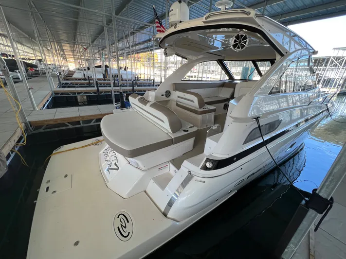 Yacht Photos Pics 2017 Regal 35 Sport Coupe docked in a covered marina.