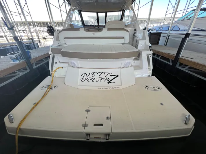  Yacht Photos Pics 2017 Regal 35 Sport Coupe yacht docked, rear view with seating and Wet Dreamz name.