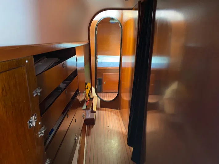 Certitude Yacht Photos Pics Interior of 1998 Fountaine Pajot Bahia 46 catamaran with wooden cabinetry and mirror.
