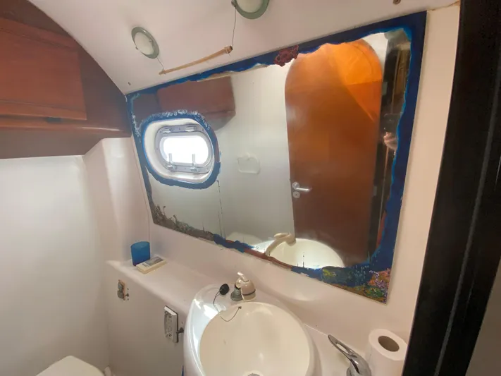 Certitude Yacht Photos Pics Bathroom interior of 1998 Fountaine Pajot Bahia 46 catamaran with mirror and sink.