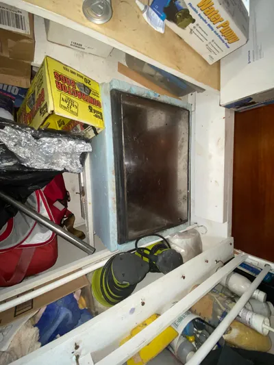 Certitude Yacht Photos Pics Cluttered storage area on a 1998 Fountaine Pajot Bahia 46 catamaran.