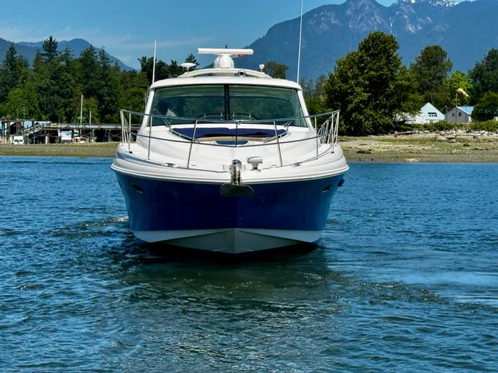 Ii-x-sessive Yacht Photos Pics 2006 Sea Ray 48 Sundancer yacht cruising on a scenic lake with mountains in the background.