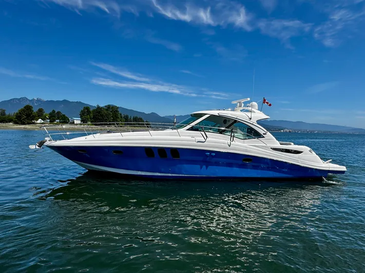 Ii-x-sessive Yacht Photos Pics 2006 Sea Ray 48 Sundancer yacht on calm water with scenic mountain backdrop.