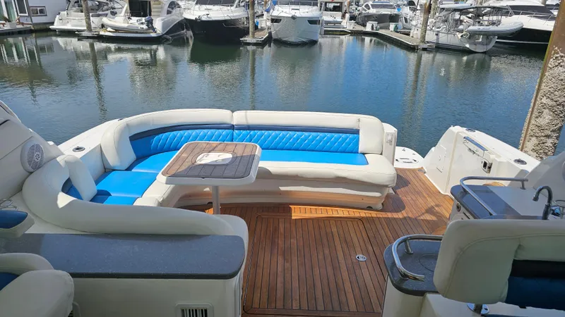Ii-x-sessive Yacht Photos Pics Luxurious 2006 Sea Ray 48 Sundancer yacht with elegant seating and teak deck in marina.