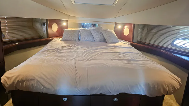 Ii-x-sessive Yacht Photos Pics Luxurious bedroom interior of 2006 Sea Ray 48 Sundancer yacht with plush bedding.