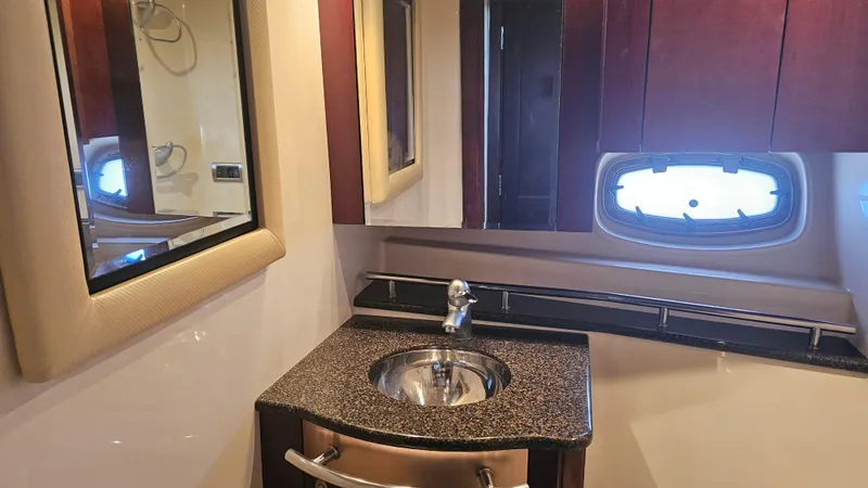 Ii-x-sessive Yacht Photos Pics Luxurious bathroom interior of 2006 Sea Ray 48 Sundancer yacht with modern sink and mirror.