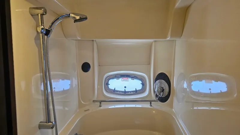 Ii-x-sessive Yacht Photos Pics Luxurious bathroom in 2006 Sea Ray 48 Sundancer yacht with shower and porthole windows.