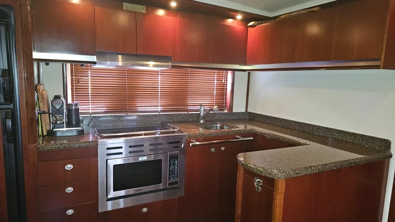 Ii-x-sessive Yacht Photos Pics Luxurious kitchen interior of 2006 Sea Ray 48 Sundancer yacht with modern appliances.