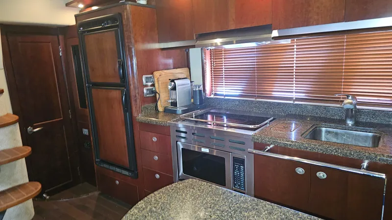 Ii-x-sessive Yacht Photos Pics Luxurious kitchen interior of 2006 Sea Ray 48 Sundancer yacht with modern appliances.
