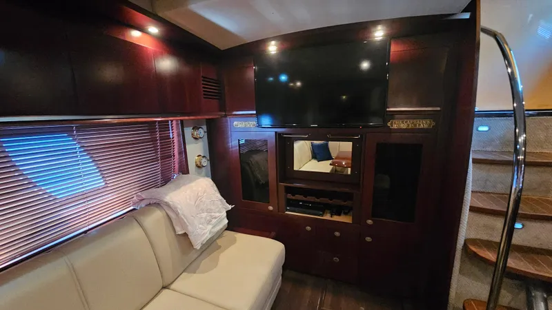 Ii-x-sessive Yacht Photos Pics Luxurious interior of 2006 Sea Ray 48 Sundancer yacht with TV and seating area.