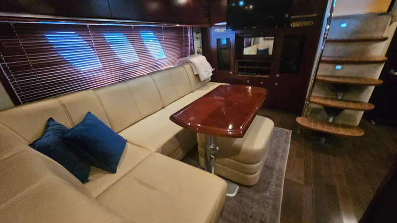 Ii-x-sessive Yacht Photos Pics Luxurious interior of 2006 Sea Ray 48 Sundancer yacht with plush seating and elegant table.