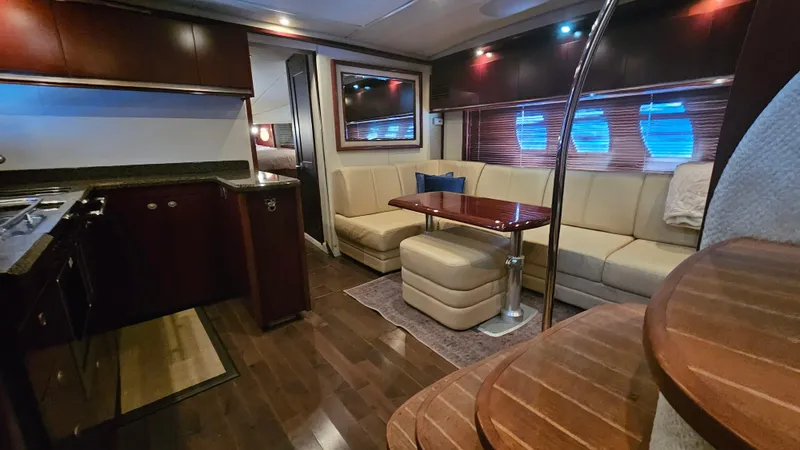 Ii-x-sessive Yacht Photos Pics Luxurious interior of 2006 Sea Ray 48 Sundancer yacht with elegant seating and dining area.