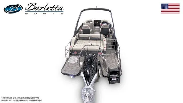  Yacht Photos Pics 2026 Barletta Lusso 23UCA luxury boat, rear view, showcasing seating and motor, with American flag.