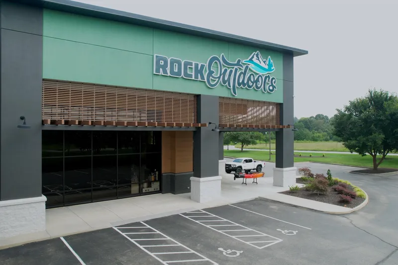  Yacht Photos Pics Outdoor store with "Rock Outdoors" sign, parking lot, and greenery. Barletta Lusso 23UCA 2026.