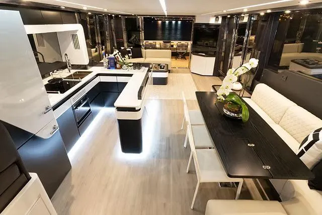  Yacht Photos Pics Luxurious interior of 2026 Schaefer 770 yacht with modern kitchen and elegant dining area.