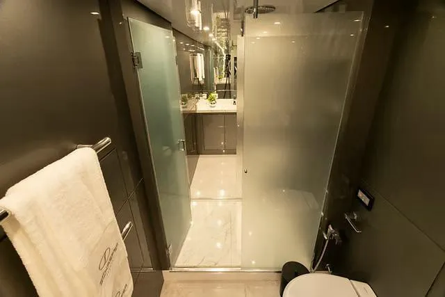  Yacht Photos Pics Luxurious bathroom in Schaefer 770 yacht, featuring modern fixtures and frosted glass shower, 2026 model.