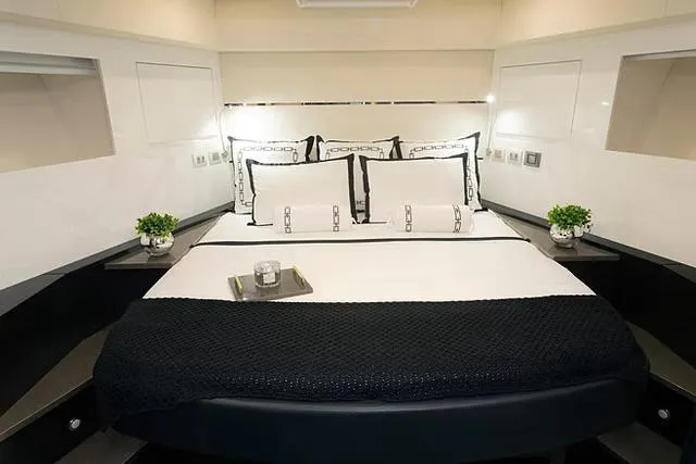  Yacht Photos Pics Luxurious bedroom interior of 2026 Schaefer 770 yacht with elegant bedding and decor.