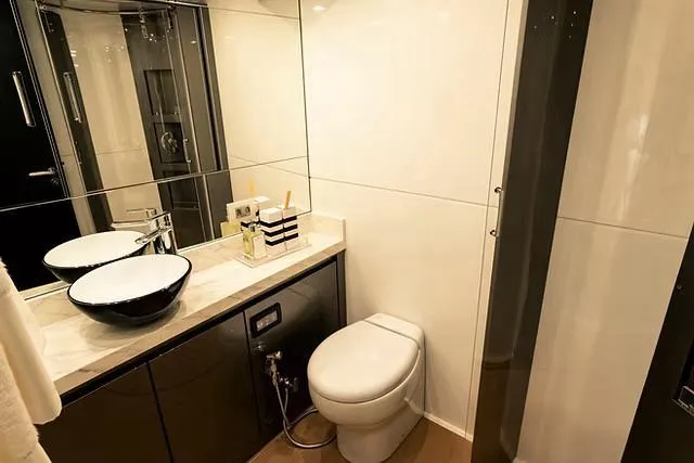  Yacht Photos Pics Modern yacht bathroom with sleek fixtures, vessel sink, and elegant design. Schaefer 770, 2026 model.