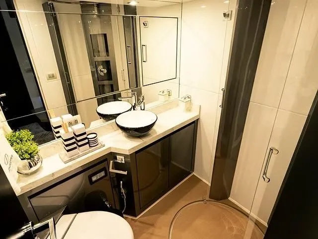  Yacht Photos Pics Luxurious bathroom in 2026 Schaefer 770 yacht with modern fixtures and elegant design.