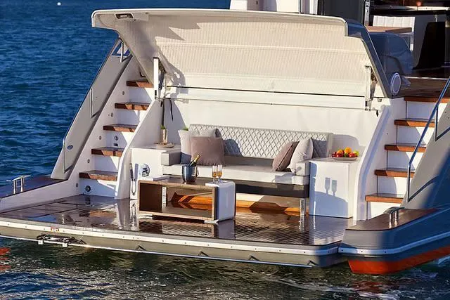  Yacht Photos Pics Luxury Schaefer 770 yacht deck with seating, table, and ocean view, 2026 model.