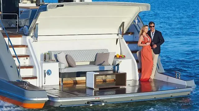  Yacht Photos Pics Couple enjoying luxury on Schaefer 770 yacht, 2026 model, with elegant deck seating.