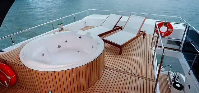  Yacht Photos Pics Luxurious Schaefer 770 yacht deck with jacuzzi and sun loungers, 2026 model.