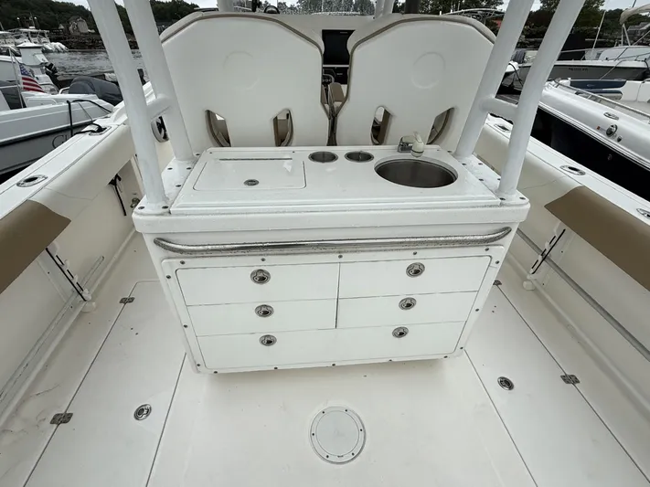  Yacht Photos Pics 2015 Edgewater 280CC boat interior with sink and storage drawers.