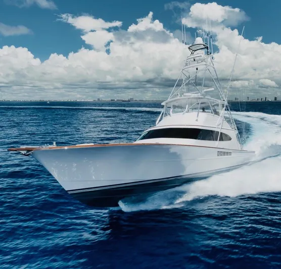 Artemis Yacht Photos Pics 2020 Merritt 77 Sportfish Convertible yacht cruising on open ocean under blue sky.