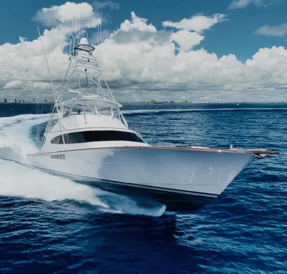 Artemis Yacht Photos Pics 2020 Merritt 77 Sportfish Convertible yacht cruising on open ocean under blue sky.