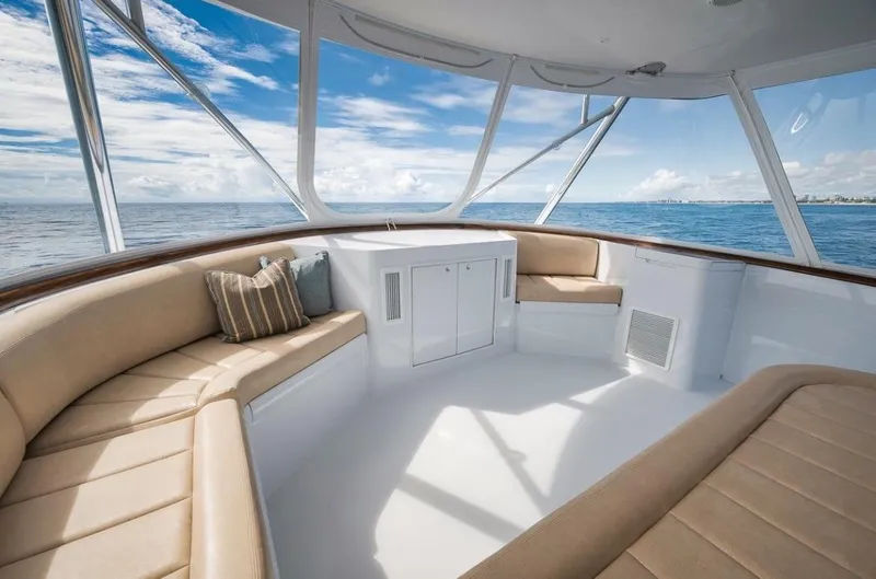 Artemis Yacht Photos Pics Interior of 2020 Merritt 77 Sportfish Convertible yacht with beige seating and ocean view.