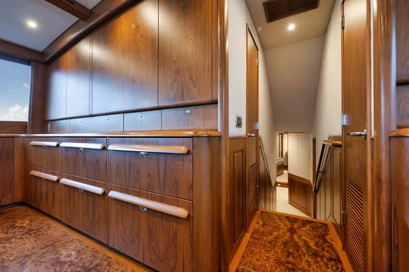 Artemis Yacht Photos Pics Interior of 2020 Merritt 77 Sportfish Convertible with elegant wood paneling and stairs.