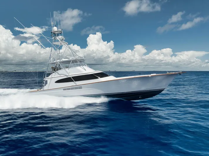 Artemis Yacht Photos Pics 2020 Merritt 77 Sportfish Convertible yacht cruising on open ocean under blue sky.