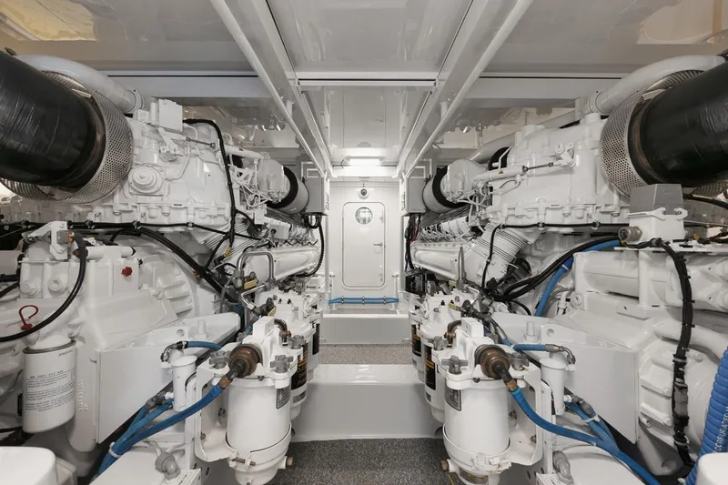 Artemis Yacht Photos Pics Engine room of 2020 Merritt 77 Sportfish Convertible, showcasing dual engines and mechanical systems.