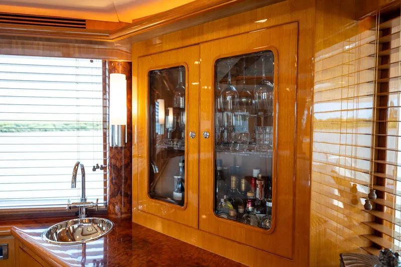 Memory Bank Yacht Photos Pics Luxurious interior of 2007 Ocean Alexander 80 Cockpit Motoryacht with elegant cabinetry and sink.