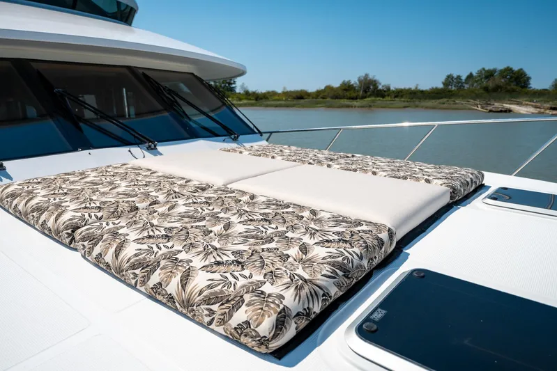 Memory Bank Yacht Photos Pics Luxurious sunbathing deck on 2007 Ocean Alexander 80 Cockpit Motoryacht, featuring patterned cushions.