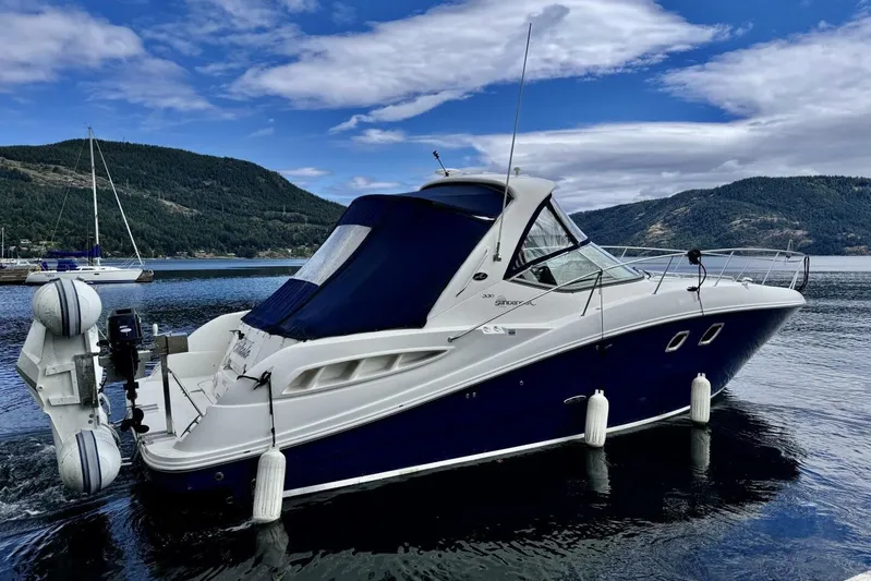  Yacht Photos Pics 2008 Sea Ray 330 Sundancer yacht on a serene lake with mountainous backdrop.