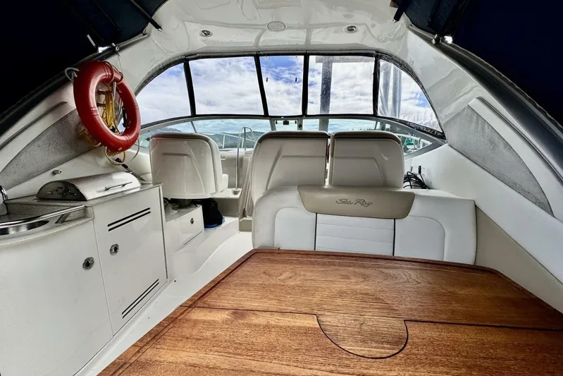  Yacht Photos Pics Interior of 2008 Sea Ray 330 Sundancer yacht with seating and kitchenette.