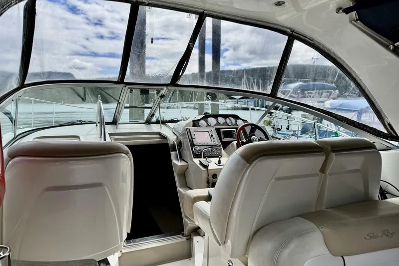  Yacht Photos Pics 2008 Sea Ray 330 Sundancer cockpit with helm, navigation equipment, and seating.