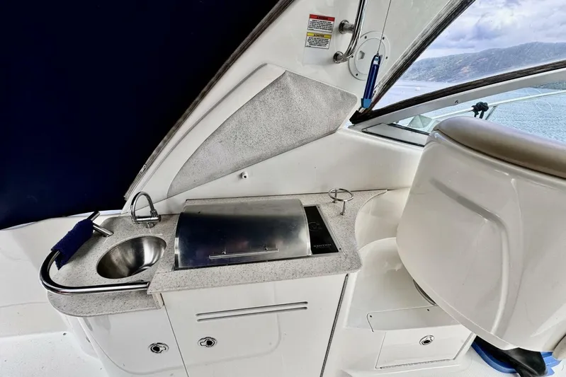  Yacht Photos Pics 2008 Sea Ray 330 Sundancer boat interior with sink and grill station.