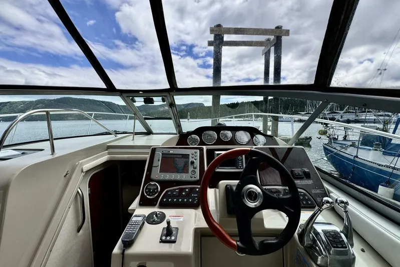 Yacht Photos Pics Cockpit view of 2008 Sea Ray 330 Sundancer, featuring steering wheel and control panel.