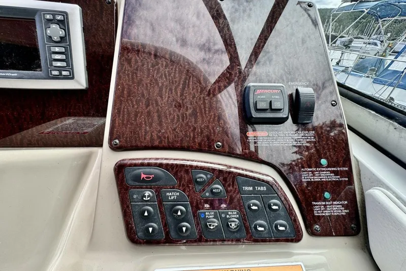  Yacht Photos Pics Control panel of a 2008 Sea Ray 330 Sundancer boat with various switches and buttons.