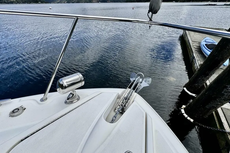  Yacht Photos Pics Bow of 2008 Sea Ray 330 Sundancer docked by calm waters.