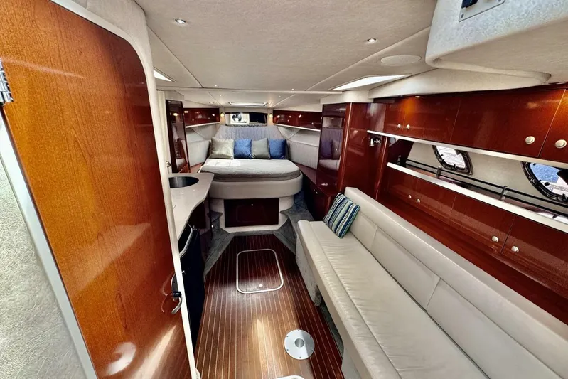  Yacht Photos Pics Luxurious interior of 2008 Sea Ray 330 Sundancer with wood finishes and comfortable seating.