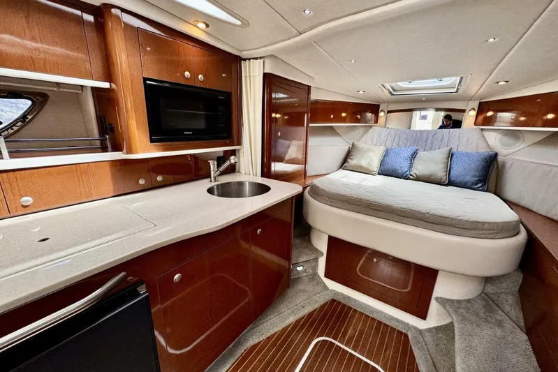  Yacht Photos Pics Luxurious 2008 Sea Ray 330 Sundancer cabin with kitchenette and cozy sleeping area.