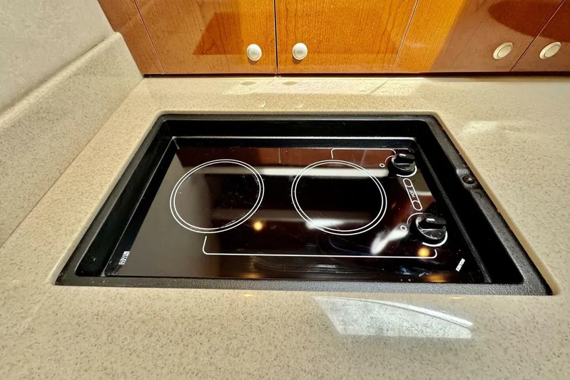  Yacht Photos Pics Built-in stovetop on 2008 Sea Ray 330 Sundancer yacht, featuring dual burners and sleek design.