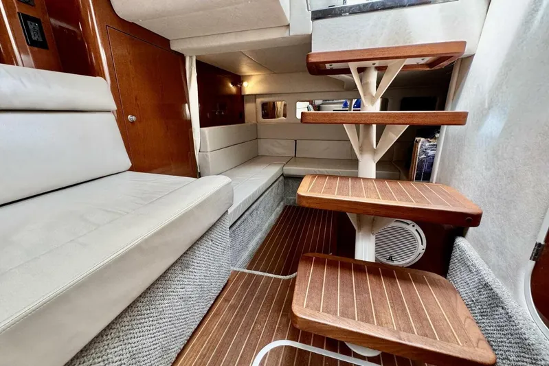  Yacht Photos Pics Interior of 2008 Sea Ray 330 Sundancer with wooden steps and cushioned seating.