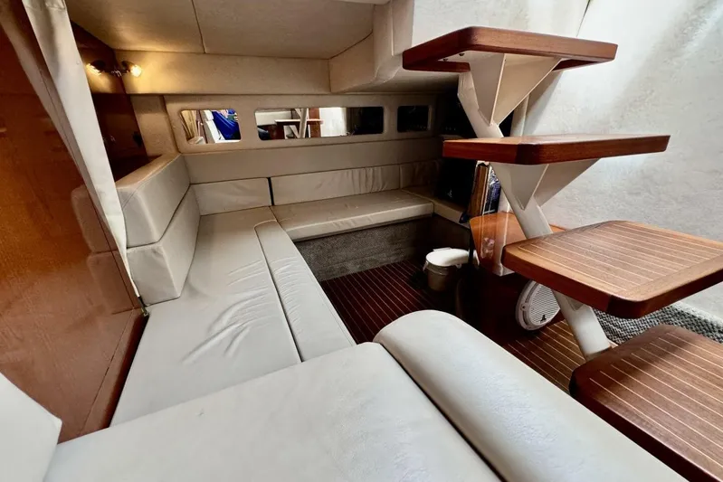  Yacht Photos Pics Luxurious interior of 2008 Sea Ray 330 Sundancer yacht with elegant seating and wooden accents.